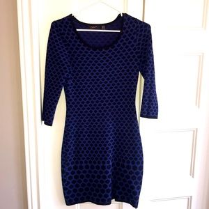 Fit and curve hugging blue and black dress